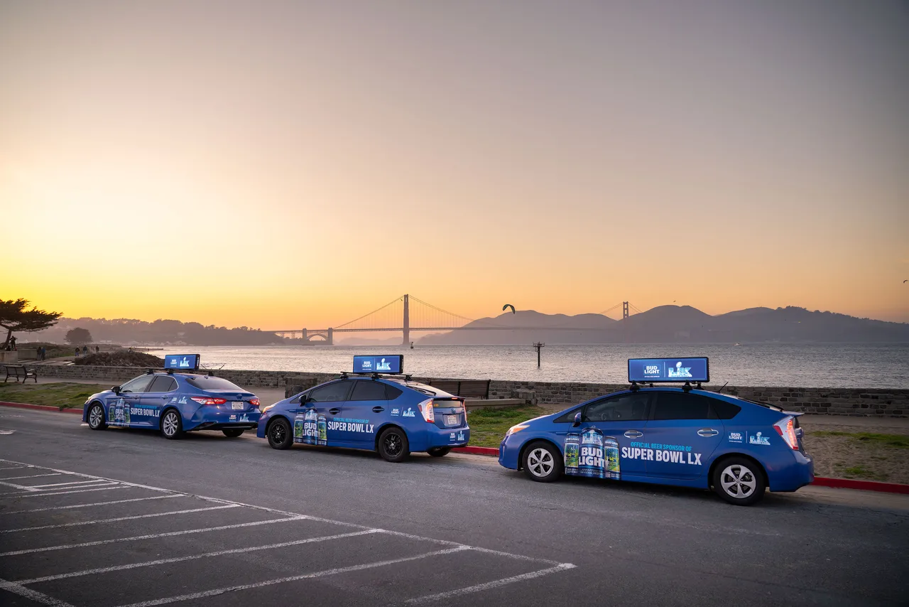 Bud Light, Super Bowl LX campaign on a swarm of wrapped cars with digital tops at the northern waterfront, facing the Golden Gate Bridge, San Francisco, 2026