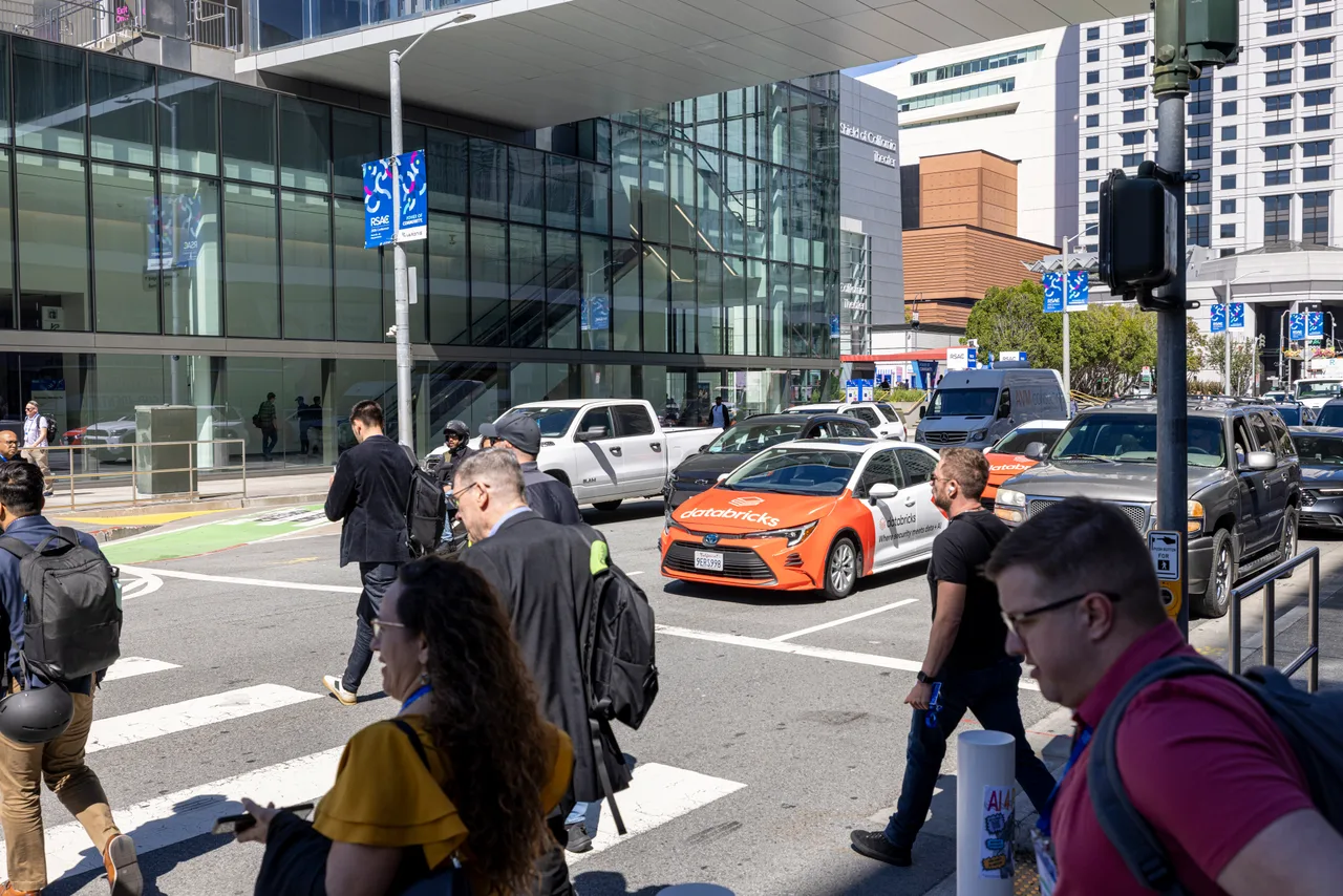 Vehicle wrap carrying a Databricks campaign in San Francisco