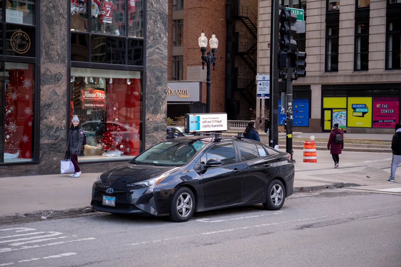 Discover campaign on a digital car-top screen at Wacker Drive at Michigan Avenue, Chicago, 2024