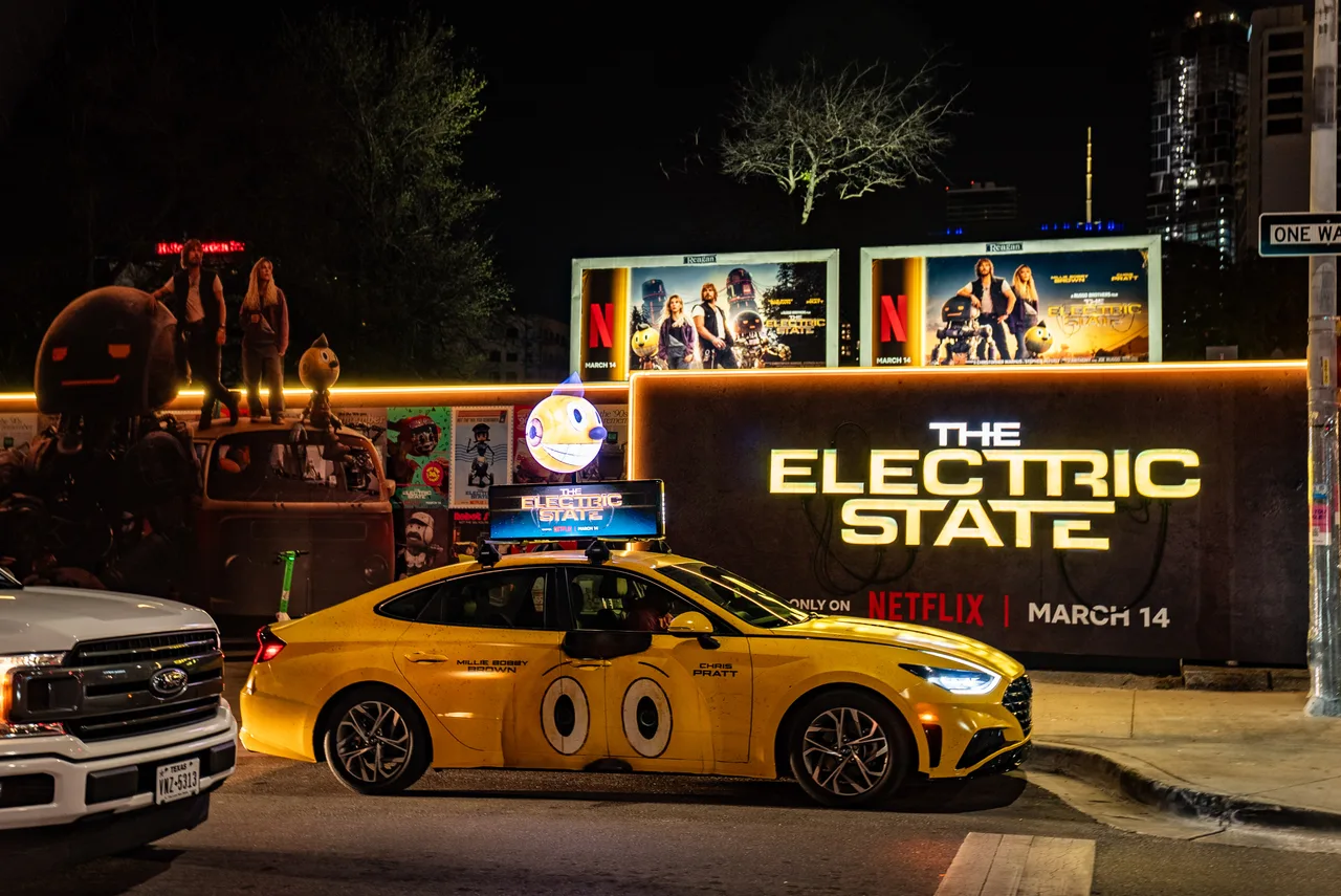 Hologram carrying a ElectricState campaign in Austin