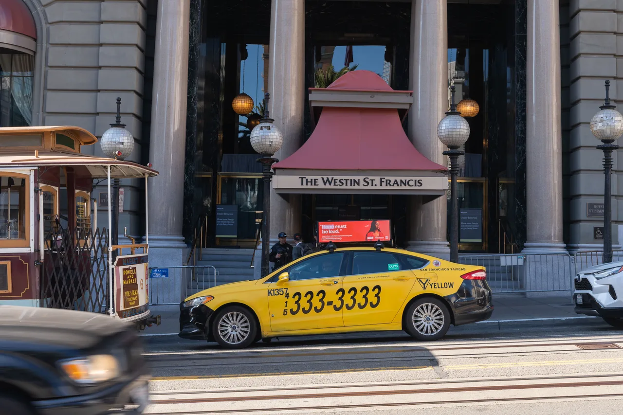 Ad Council campaign on a digital taxi-top screen at the Westin St. Francis, Powell Street cable car line, San Francisco, 2025
