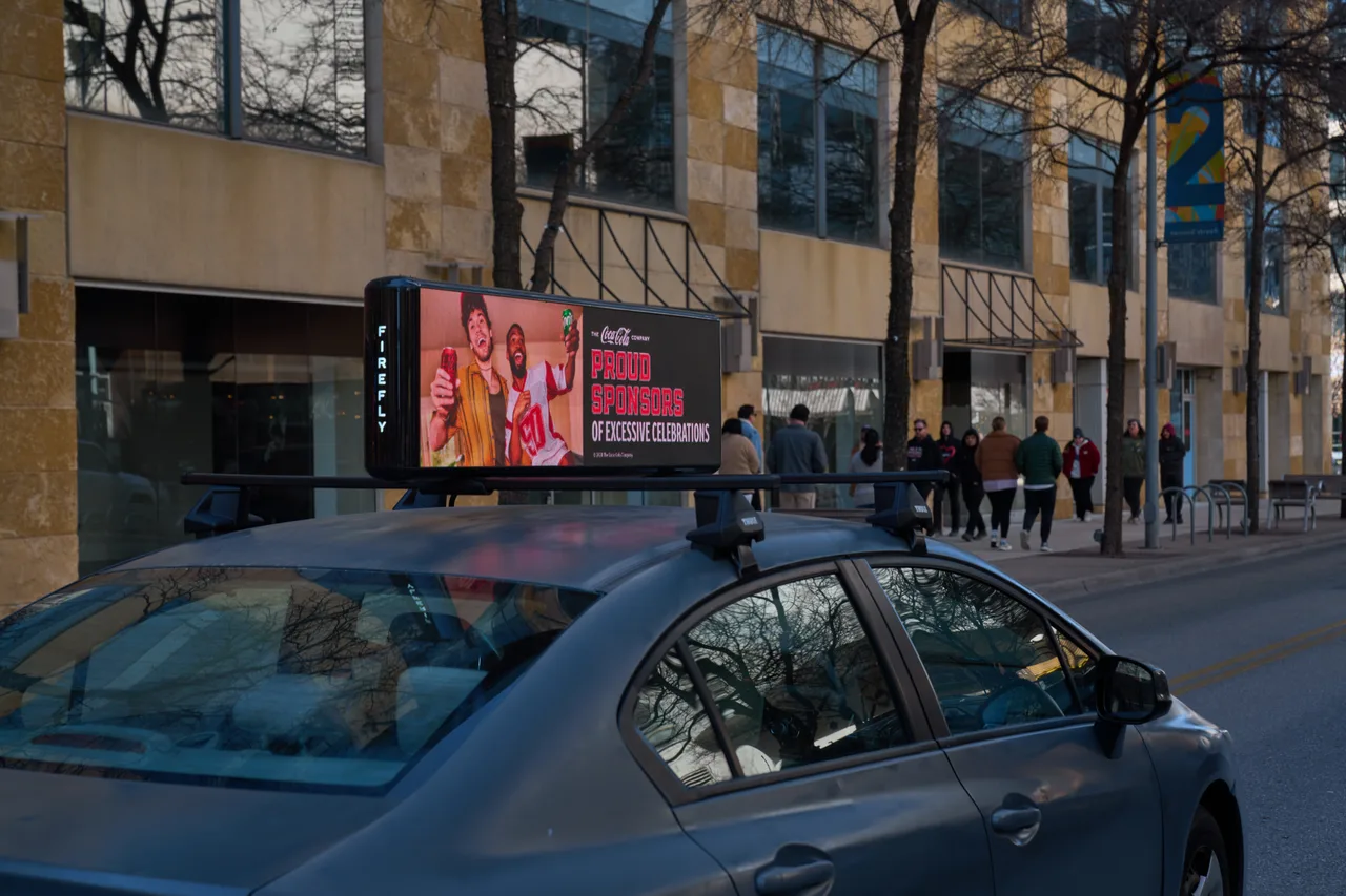 Coke campaign on a digital screen in Austin, 2024