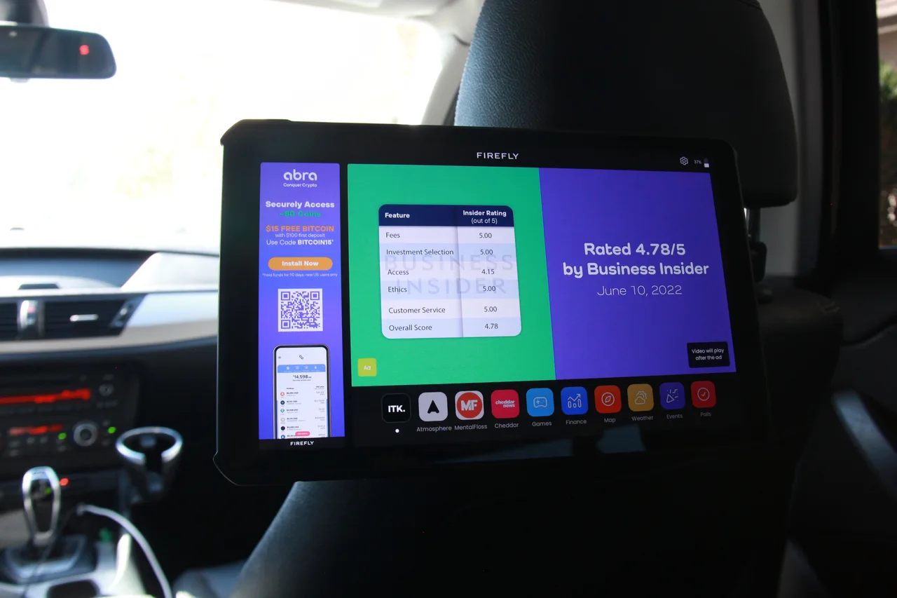 In-car screen carrying a Abra campaign in Dallas