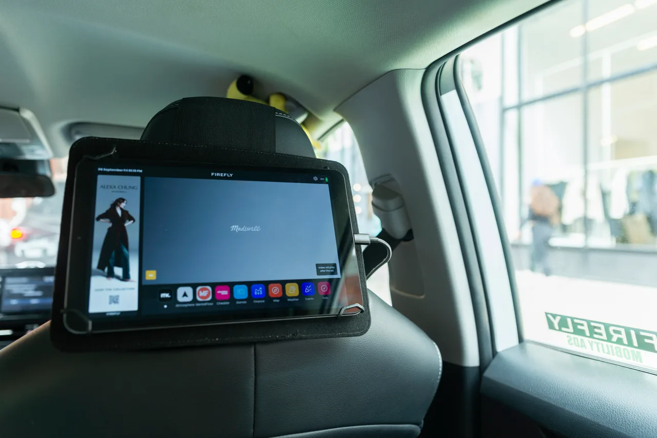 In-car screen carrying a Madewell campaign in New York