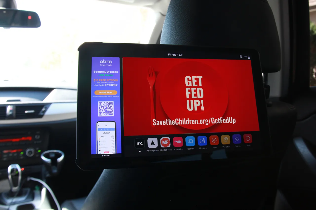 In-car screen carrying a SaveTheChildren campaign in Miami