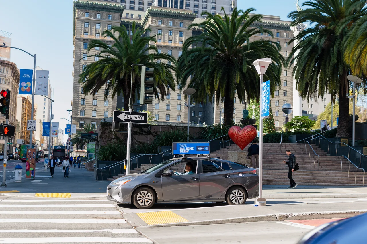 American Express campaign on a digital car-top screen at Union Square, Small Business Saturday, San Francisco, 2023