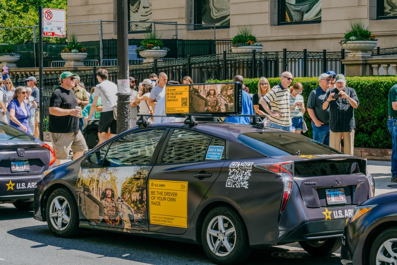 U.S. Army campaign on a swarm of wrapped cars with digital tops at Michigan Avenue, NASCAR Chicago Street Race weekend, Chicago, 2024
