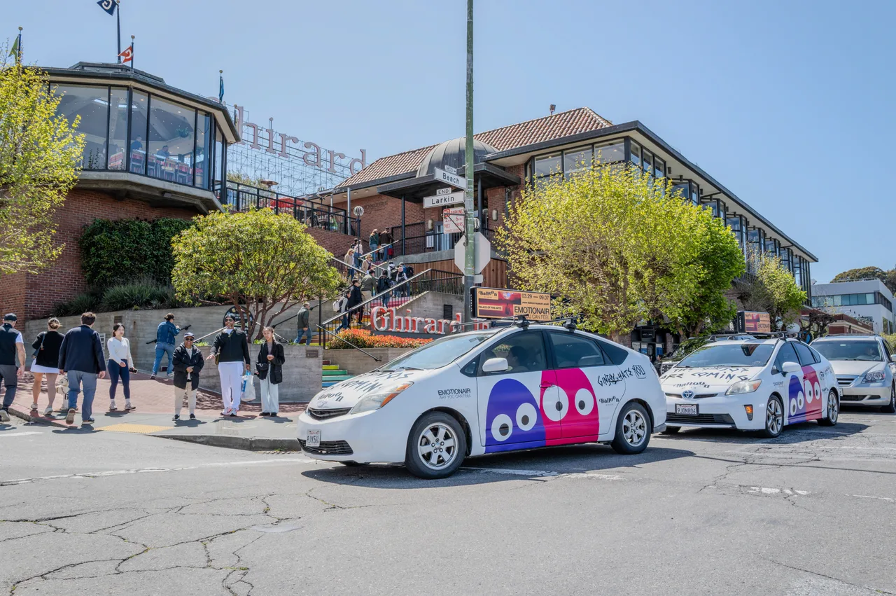 Balloon Museum campaign on a swarm of wrapped cars with digital tops at Ghirardelli Square, Beach and Larkin, San Francisco, 2025