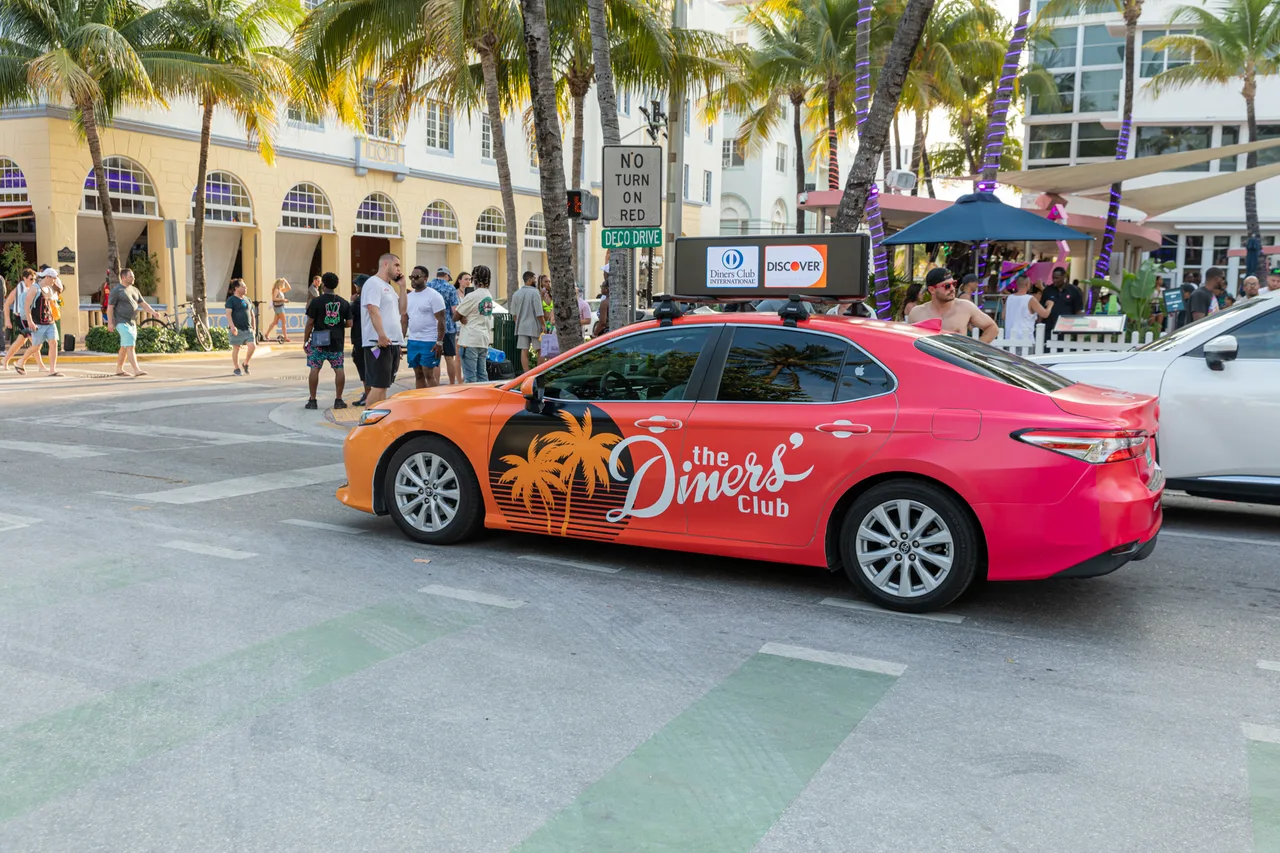 Vehicle wrap carrying a Discovercard campaign in Miami