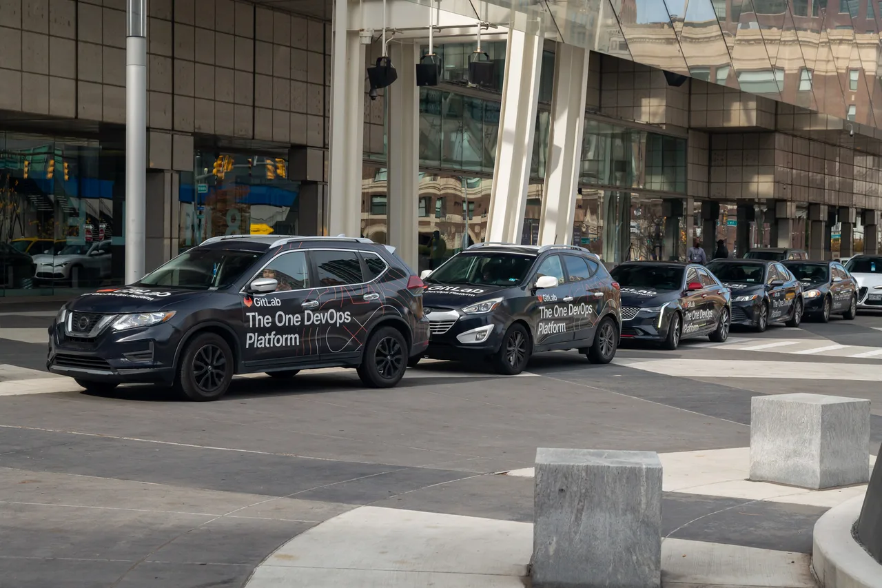 Vehicle wrap carrying a GitLab campaign in Detroit
