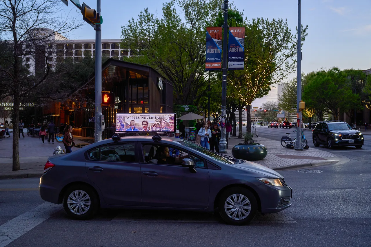 Digital screen carrying a Peacock campaign in Austin