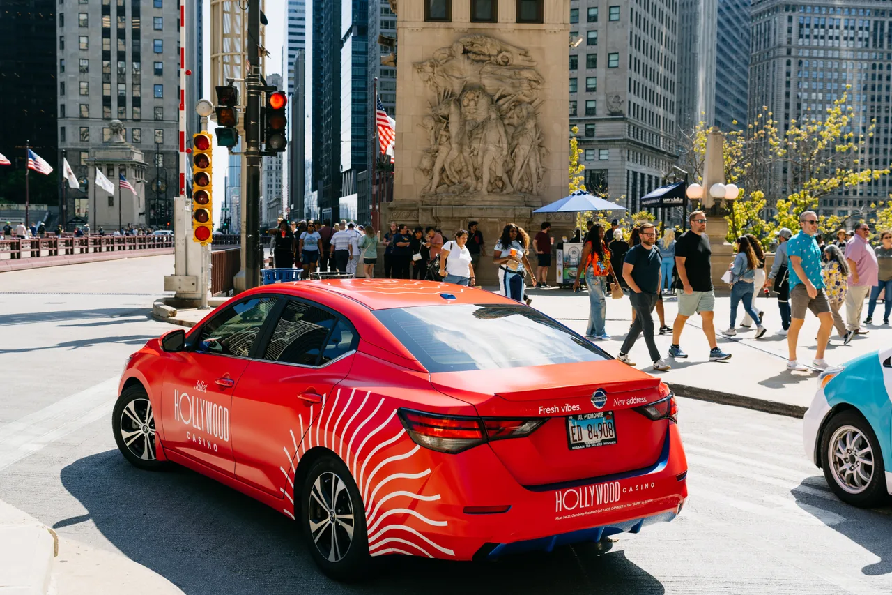 Vehicle wrap carrying a PennNationalGaming campaign in Chicago