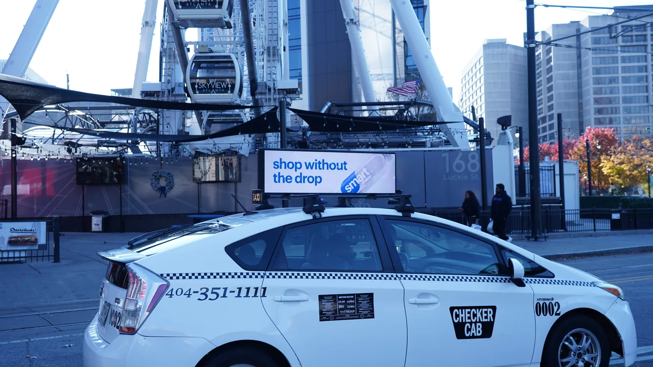 smartwater campaign on a digital taxi-top screen at SkyView Atlanta, Luckie Street, Atlanta, 2024