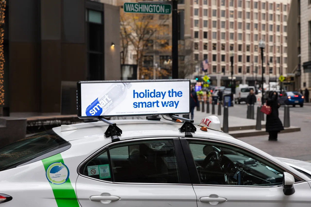 smartwater campaign on a digital taxi-top screen in Boston, 2025