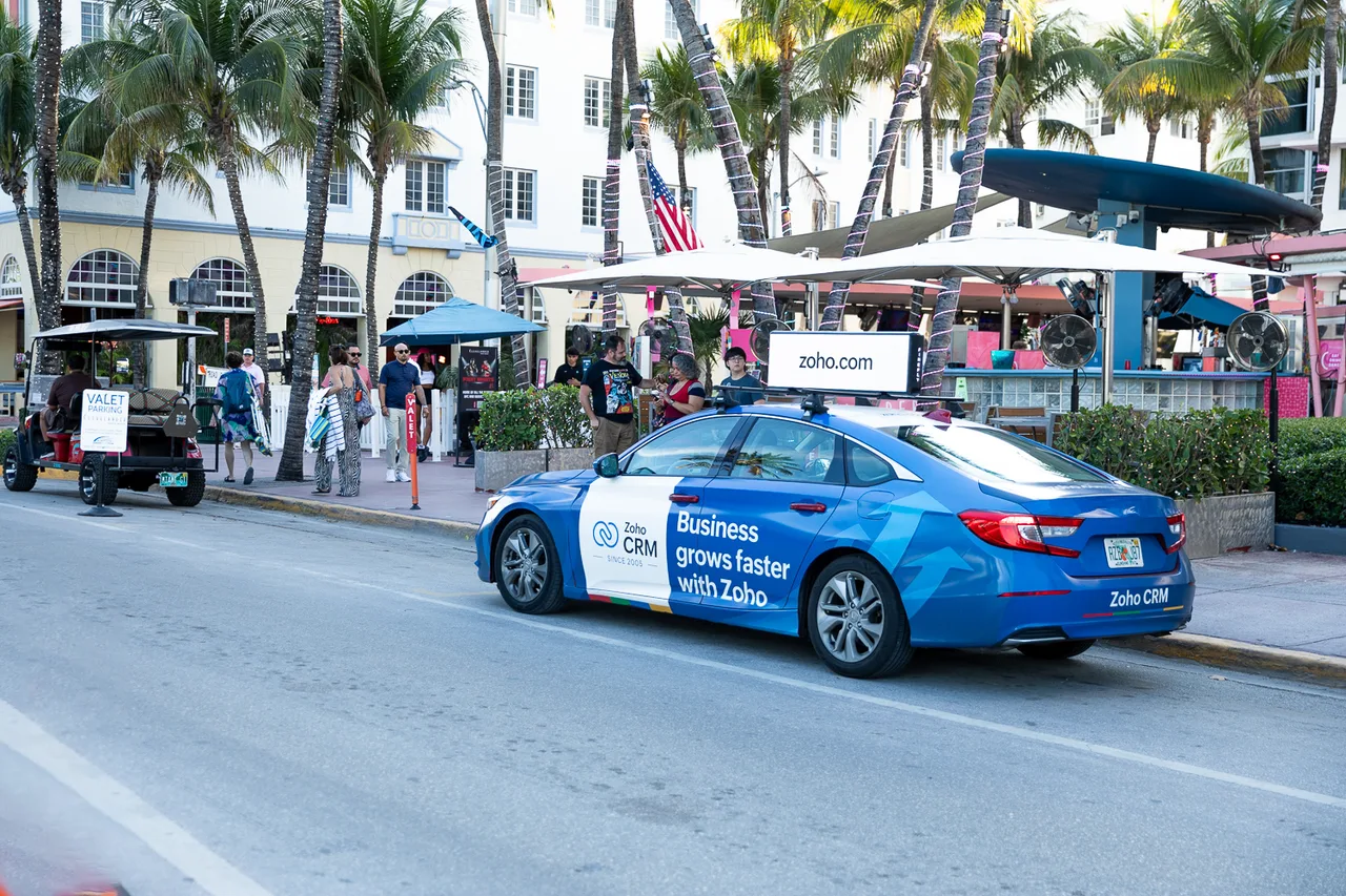 Zoho campaign on a digital screen in Miami, 2025