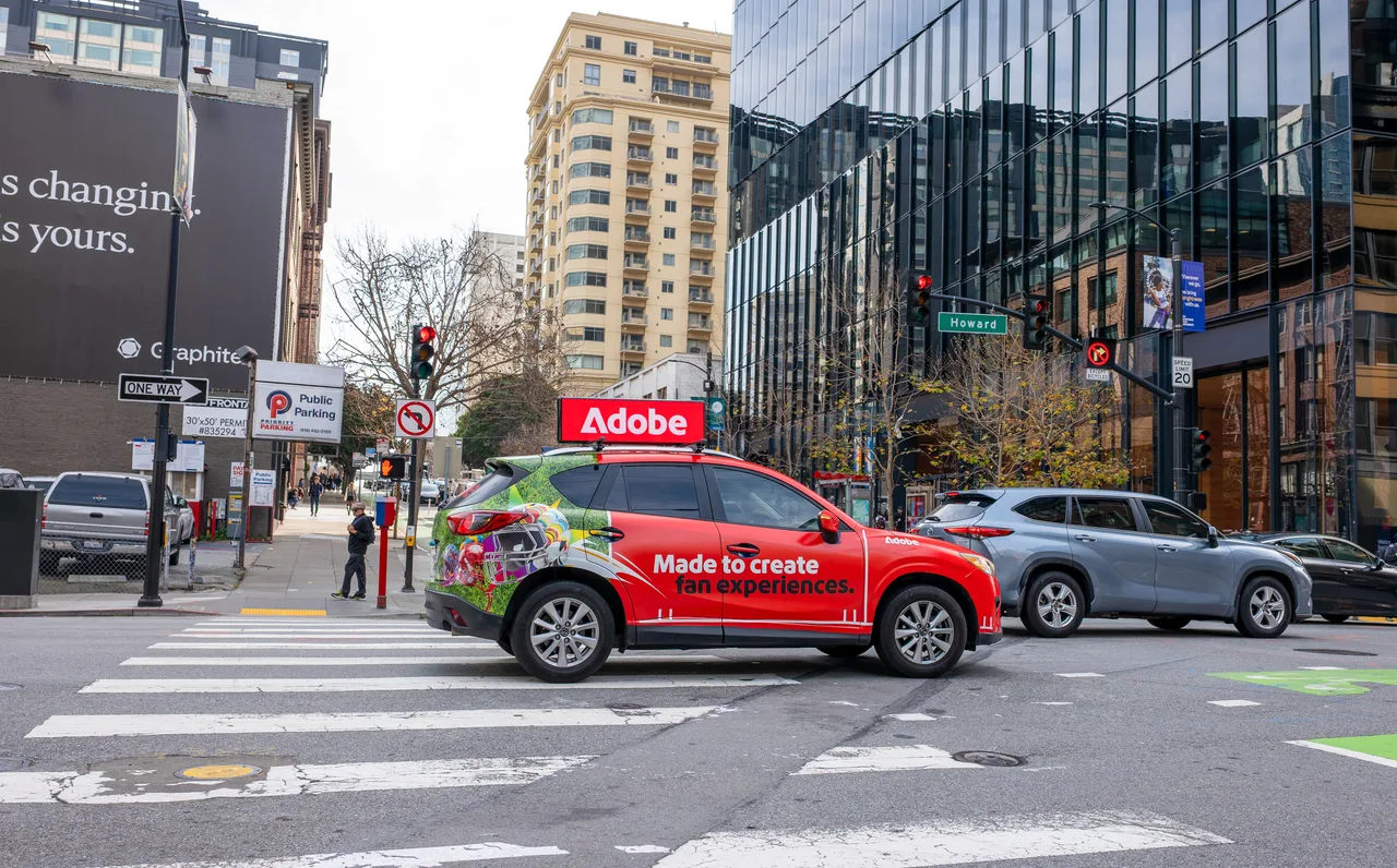Digital screen carrying a Adobe campaign in San Francisco