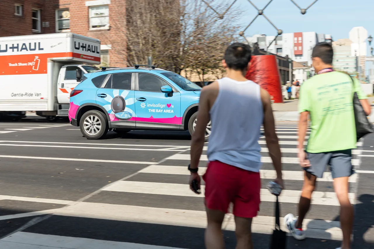 Vehicle wrap carrying a Invisalign campaign in San Jose
