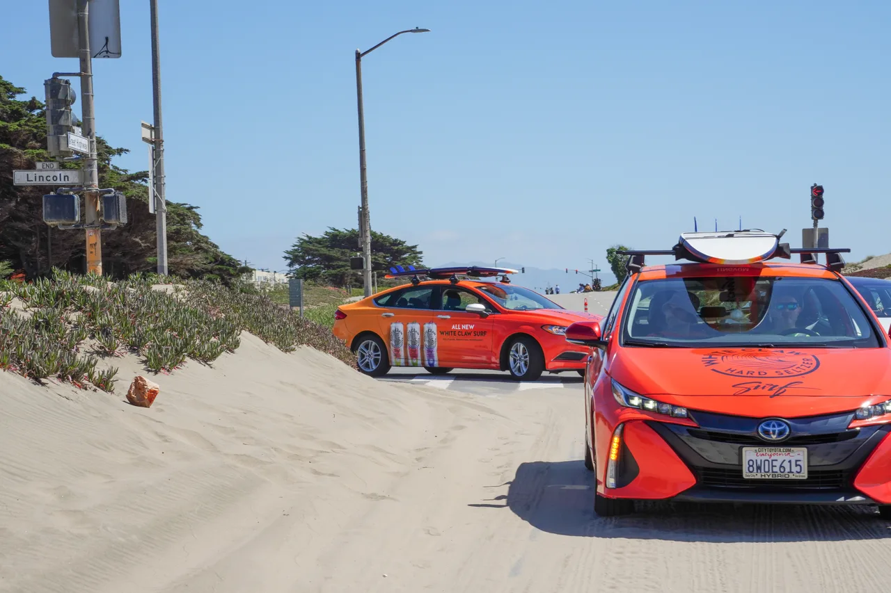 White Claw Surf campaign on a swarm of wrapped cars at Lincoln Way at Ocean Beach, San Francisco, 2022