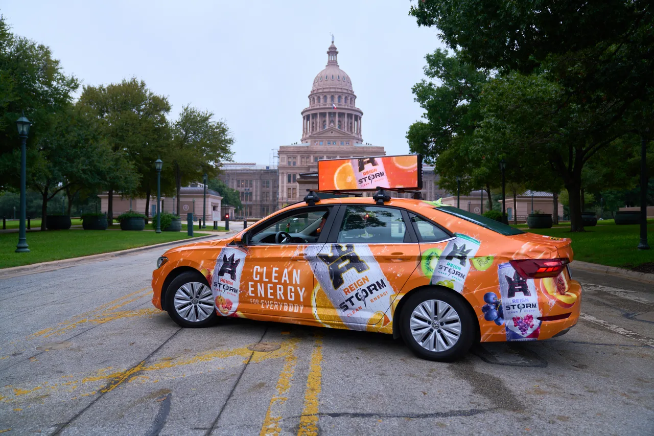 Reign campaign on a vehicle wrap in Austin, 2023