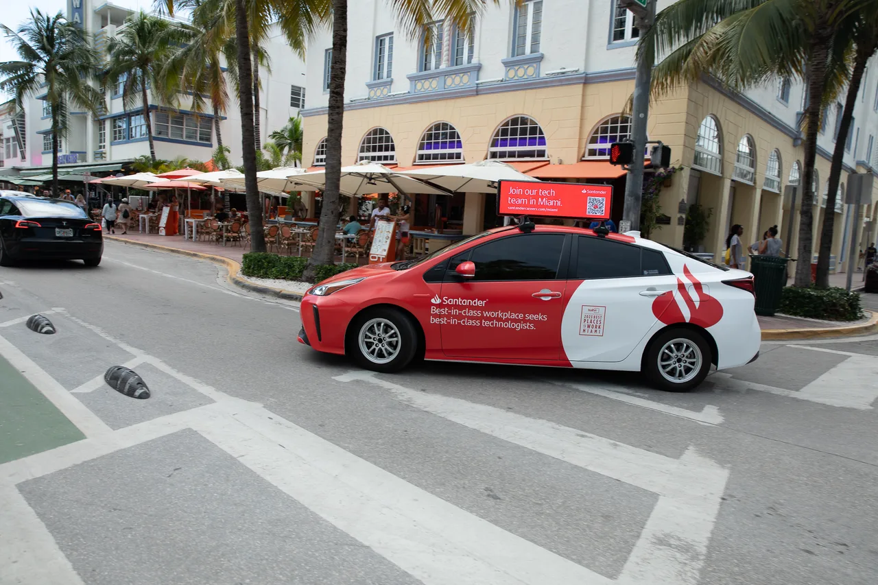 Vehicle wrap carrying a Santander campaign in Miami