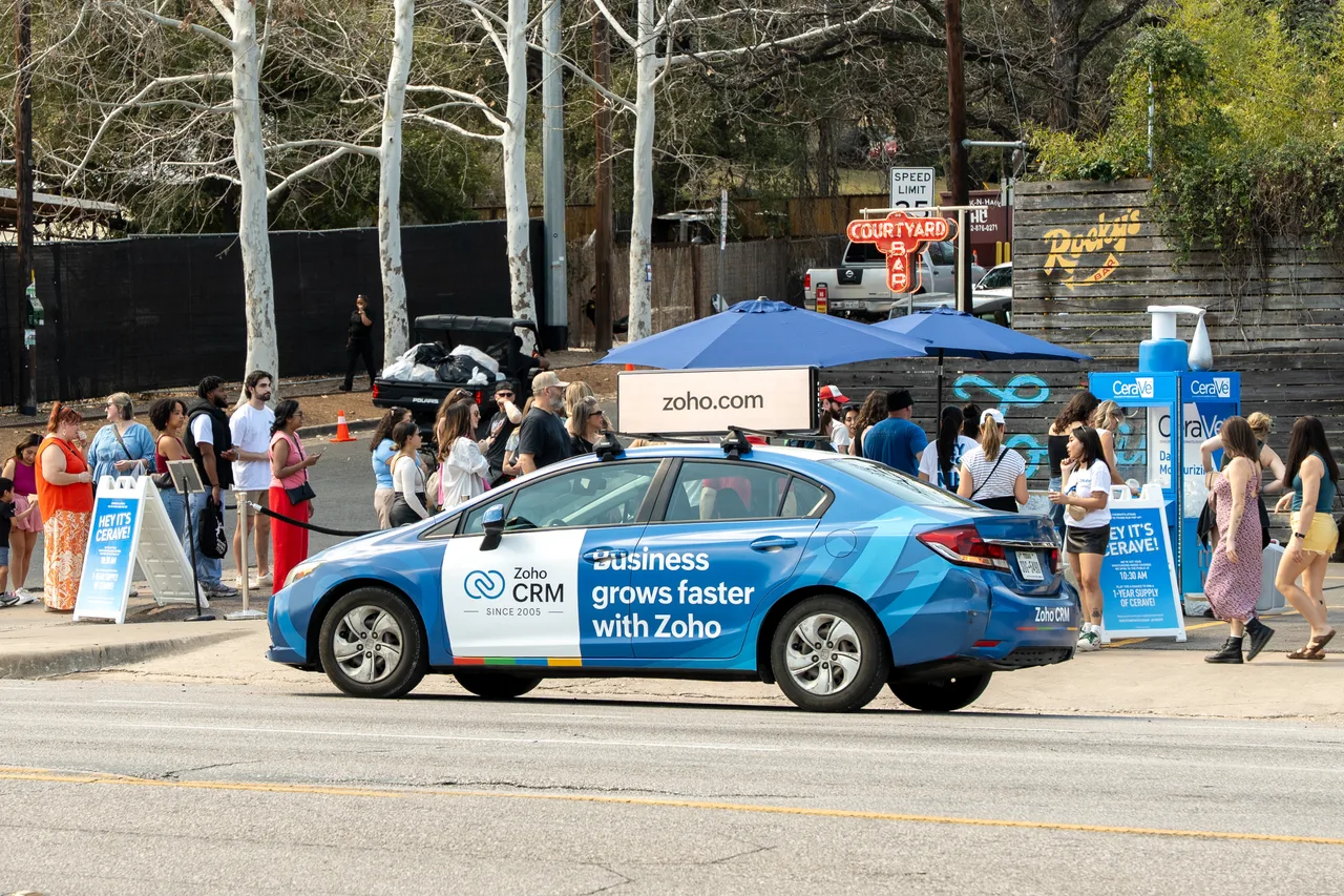 Digital screen carrying a Zoho campaign in Austin